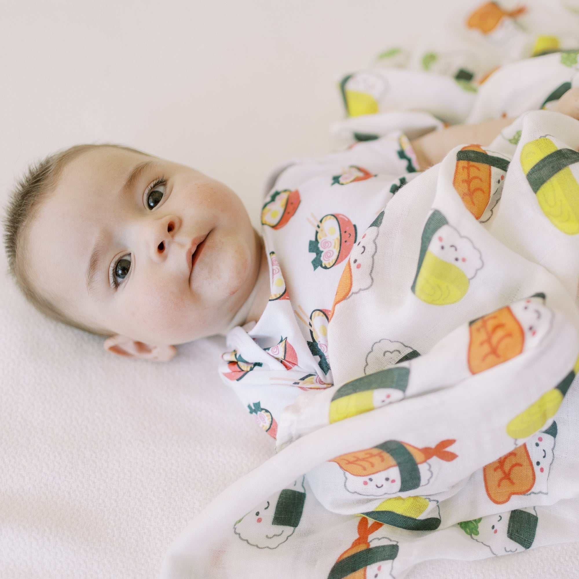 the wee bean organic and sustainable baby gift set with blankets bibs swaddle and rattle doll in taste of japan sushi tempura