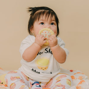 baby chewing on the wee bean handmade fair-trade siu mai dim sum rattle doll