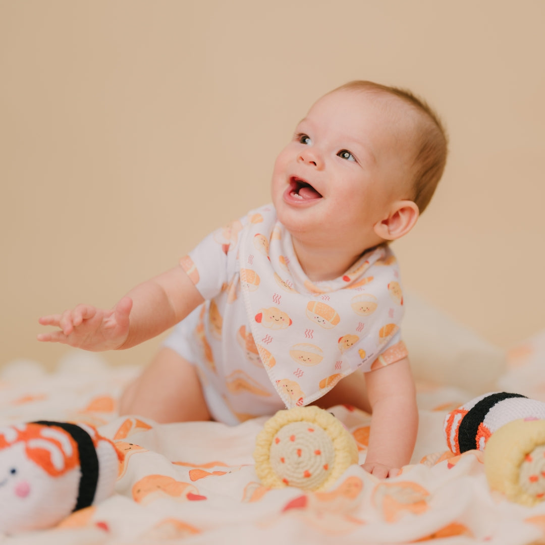 the wee bean welcome baby newborn gift set bakery buns sausage bun cocktail bun coconut cream bun organic swaddle milestone blanket organic cotton bandana bibs fair trade rattle doll